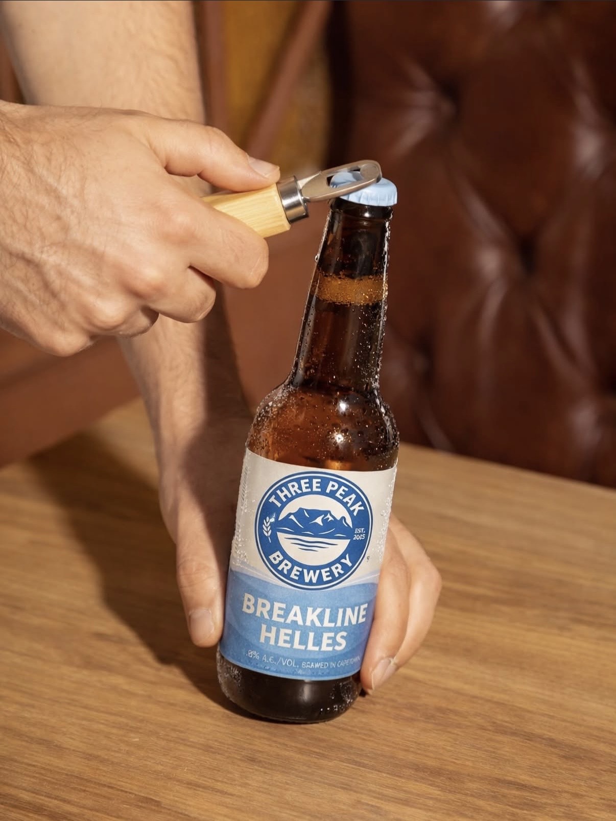 Breakline Helles bottle being opened